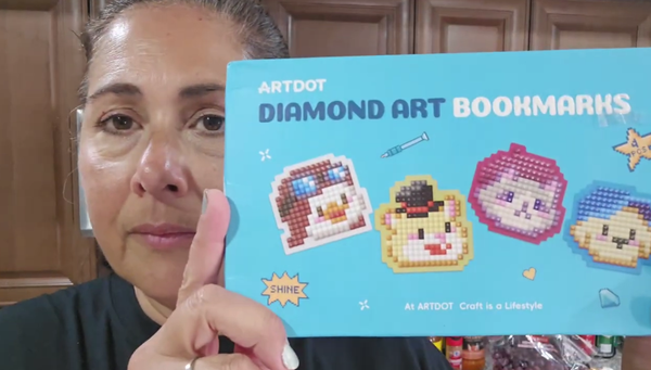 Handmade SparkleMark bookmark in a book